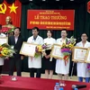 Quang cảnh buổi lễ trao bằng khen của Bộ trưởng Bộ Y tế. (Ảnh: PV/Vietnam+)