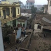Những ngôi nhà bị tan tác do Vụ nổ gây ra. (Ảnh: PV/Vietnam+)