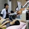 Khám thai cho bệnh nhân tại bệnh viện Phụ sản Hà Nội. (Ảnh: TTXVN)