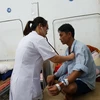 Bác sỹ thuộc Dự án bác sỹ tình nguyện khám chữa bệnh cho người dân tại Bệnh viện Đa khoa huyện Hà Quảng, Cao Bằng. (Ảnh: PV/Vietnam+)
