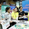 Tuyên truyền về công tác dân số tại Hà Nội. (Ảnh: TTXVN)