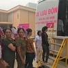 Xe lưu động khám sàng lọc phát hiện ung thư cho phụ nữ. (Ảnh:PV/Vietnam+)
