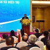 Thứ trưởng Bộ Y tế Nguyễn Viết Tiến phát biểu tại hội nghị. (Ảnh: PV/Vietnam+)
