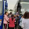 [Photo] 600 bệnh nhân về quê đón Tết trên chuyến xe miễn phí