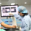 Ca phẫu thuật cột sống đầu tiên bằng robot được triển khai tại Bệnh viện Đa khoa tỉnh Phú Thọ. (Ảnh: PV/Vietnam+)