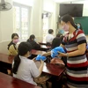 Chương trình “Vững vàng Việt Nam” nhằm nâng cao nhận thức của người dân về phòng bệnh COVID-19. (Ảnh: An Đăng/TTXVN)