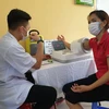 Người dân đến khám bệnh tăng huyết áp tại Bệnh viện Hữu nghị Việt Đức ngày 27/6. (Ảnh: T.G/Vietnam+)