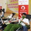 Học viên của Học viện Cảnh sát Nhân dân tham gia hiến máu tại ngày hội chính của Chủ nhật đỏ. (Ảnh: PV/Vietnam+)