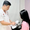 Bệnh nhân T.H.T ở Thanh Hóa tới khám và điều trị tại Bệnh viện Trung ương Quân đội 108. (Ảnh: PV/Vietnam+)
