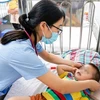 Trẻ mắc bệnh tay chân miệng điều trị tại Bệnh viện Nhi Trung ương. (Ảnh: PV/Vietnam+)