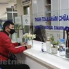 Người dân làm thủ tục khám chữa bệnh. (Ảnh: T.G/Vietnam+)