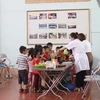 Hướng dẫn thực hành nấu bữa ăn dinh dưỡng cho trẻ tại huyện Mường Khương, tỉnh Lào Cai. (Ảnh: PV/Vietnam+)