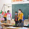 Tất cả học sinh và giáo viên Trường Phổ thông Dân tộc Bán trú Tiểu học xã Khâu Vai (Mèo Vạc, Hà Giang) đeo khẩu trang để phòng, chống bệnh bạch hầu. (Ảnh: Hoàng Hiếu/TTXVN)