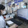 Người bệnh đến khám, chữa bệnh bằng căn cước công dân tại Trung tâm Y tế huyện Hữu Lũng, Lạng Sơn. (Ảnh: Anh Tuấn/TTXVN) 