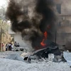 Khói bốc lên sau xung đột tại thành phố miền bắc Aleppo ngày 20/6. (Ảnh: AFP/TTXVN)