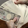 Đồng yen trượt xuống mức thấp nhất 7 năm qua so với đồng USD