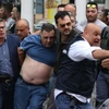 Italy: 10 người thương vong trong vụ xả súng chỉ vì cái dây phơi