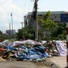  Những bãi rác thải trong khu dân cư thị xã Sơn Tây. (Ảnh: Hoàng Lâm/TTXVN)