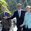 Thủ tướng Đức Angela Merkel (phải) và phu quân Joachim Sauer (trái) đón Tổng thống Mỹ Barack Obama tham dự Hội nghị thượng đỉnh G-7. (Nguồn: AFP/TTXVN)