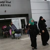  Người dân Palestine trở về Gaza qua cửa khẩu Rafah. (Nguồn: AFP/TTXVN)