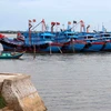Tàu thuyền neo đậu tránh trú bão tại khu neo đậu Cửa Hội (Nghệ An) chiều 22/6. (Ảnh: Thanh Tùng/TTXVN)