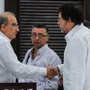  Đại diện của Chính phủ Colombia và FARC tại cuộc họp báo ở La Habana sau khi kết thúc vòng đàm phán. (Nguồn: AFP/TTXVN)