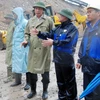 Chủ tịch tỉnh Quảng Ninh Nguyễn Đức Long kiểm tra công tác khắc phục sự cố do mưa lũ tại đập 790 chân bãi thải Đông Cao Sơn, phường Mông Dương. (Ảnh: Nguyễn Hoàng/TTXVN)