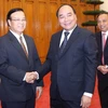 Phó Thủ tướng Nguyễn Xuân Phúc tiếp Bộ trưởng Bộ Kế hoạch và Đầu tư Lào Somdy Douangdy. (Ảnh: Phương Hoa/TTXVN)