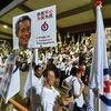 Những người ủng hộ PAP vui mừng sau khi kết quả bầu cử được công bố. (Nguồn: AFP/TTXVN)