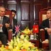 Thống đốc Nguyễn Văn Bình tiếp cựu Thủ tướng Anh Tony Blair. (Ảnh: Trần Việt/TTXVN)