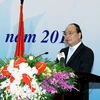 Phó Thủ tướng Nguyễn Xuân Phúc dự và phát biểu tại hội nghị. (Ảnh: Nguyễn Dân/TTXVN)