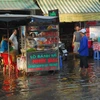 Triều cường gây ngập nước tại Thành phố Hồ Chí Minh. (Ảnh: Mạnh Linh/TTXVN)