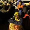 Người di cư tại trại tiếp nhận ở Tripoli, Libya. (Nguồn: THX/TTXVN)