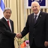 Đại sứ Cao Trần Quốc Hải và Tổng thống Israel Reuven Rivlin tại lễ trình quốc thư. (Ảnh: B.Hoàn/Vietnam+) 