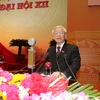 Tổng Bí thư Nguyễn Phú Trọng đọc Báo cáo của Ban Chấp hành Trung ương Đảng khóa XI về các văn kiện trình Đại hội XII của Đảng. (Nguồn: TTXVN)