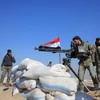 Lực lượng ủng hộ Chính phủ Syria gác tại Tal Sharba, ngoại ô thành phố Aleppo, miền Bắc Syria. (Nguồn: AFP/TTXVN)