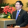 Phó Thủ tướng Phạm Bình Minh trình bày Báo cáo về việc phê chuẩn Công hàm Thỏa thuận về cấp thị thực giữa Việt Nam và Hoa Kỳ. (Ảnh: Thống Nhất/TTXVN)