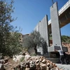 Israel xây dựng hàng rào chắn mới tại Thung lũng Cremisan sát thị trấn Beit Jala, gần thành phố Bethlehem, Khu Bờ Tây. (Nguồn: AFP/TTXVN)
