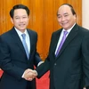 Thủ tướng Nguyễn Xuân Phúc tiếp Bộ trưởng Ngoại giao Lào Saleumxay Kommasith. (Ảnh: Thống Nhất/TTXVN)