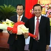 Ông Nguyễn Xuân Anh (trái) được bầu giữ chức Chủ tịch HĐND thành phố Đà Nẵng khóa IX. (Ảnh: Trần Lê Lâm/TTXVN)