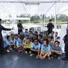 Các ngư dân Việt Nam bị MMEA bắt giữ. (Nguồn: bernama.com)