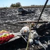 Tưởng niệm nạn nhân vụ rơi máy bay MH17 tại khu vực gần làng Hrabove, Ukraine. (Nguồn: AFP/TTXVN)