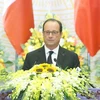Tổng thống Pháp Francois Hollande đọc Diễn văn tại buổi chiêu đãi. (Ảnh: Nhan Sáng/TTXVN)