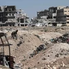 Nhà cửa bị phá hủy tại thành phố Aleppo, miền Bắc Syria. (Nguồn: THX/TTXVN)
