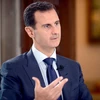 Tổng thống Syria Bashar al-Assad trả lời báo giới tại Damascus ngày 13/7. (Nguồn: EPA/TTXVN)