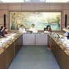 Đoàn đại biểu Quốc hội thành phố Hà Nội thảo luận tại tổ. (Ảnh: Phạm Kiên/TTXVN)