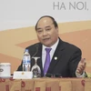 Thủ tướng Nguyễn Xuân Phúc chủ trì buổi họp báo quốc tế. (Nguồn: TTXVN) 