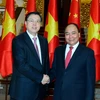 Thủ tướng Nguyễn Xuân Phúc tiếp Ủy viên trưởng Trương Đức Giang. (Ảnh: Thống Nhất/TTXVN)