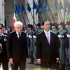 Tổng thống Italy Sergio Mattarella và Chủ tịch nước Trần Đại Quang duyệt đội danh dự. (Ảnh: Nhan Sáng/TTXVN)