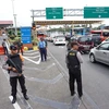 Cảnh sát Indonesia tuần tra tại sân bay Sukarno-Hatta ở Tangerang, ngoại ô Jakarta. (Nguồn: AFP/TTXVN)